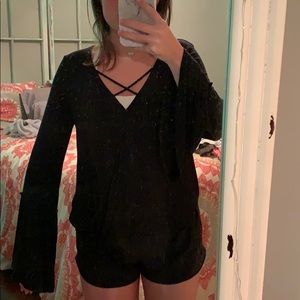 super cute black top with flared sleeves